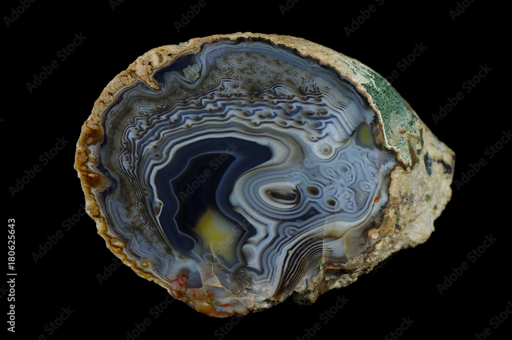 A cross section of the agate stone. Agate irregularly meshed. Origin: Rudno near Krakow, Poland. A cross section of the agate stone. Agate irregularly meshed. Origin: Rudno near Krakow, Poland.