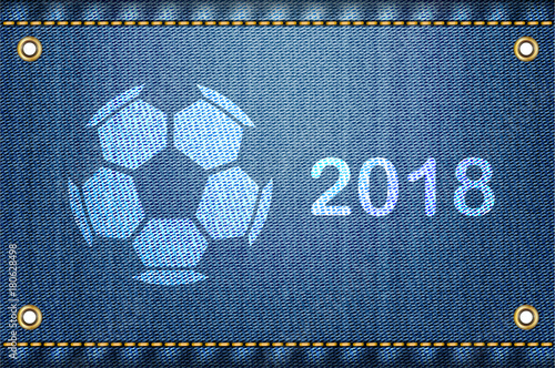 Soccer ball on blue jeans background. 2018