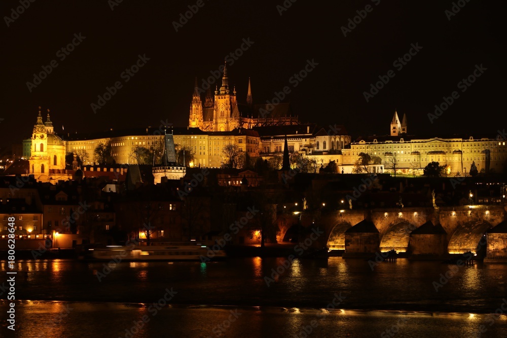 illuminated Charles bridge and Prague Castle at night, Czech Republic