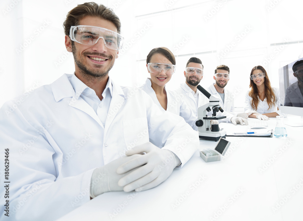 Male scientist and the team in the lab. Male scientist and the team in the lab.