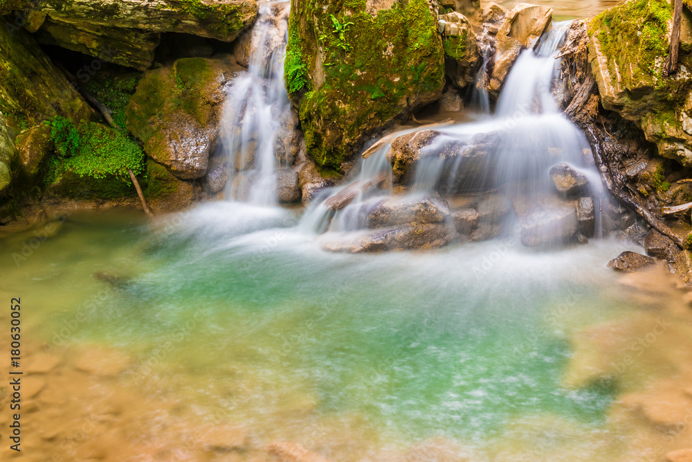 Waterfall and small lake in the ravine Chudo-Krasotka in summer day, Sochi, Russia
Waterfall and small lake in the ravine Chudo-Krasotka in summer day, Sochi, Russia