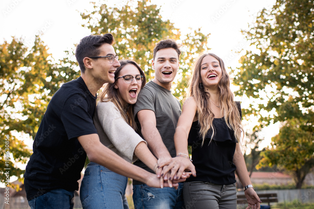 Friendship > Student teamwork. Closeup of man and woman hands together stack. Friendship forever, togetherness, youth team concept Friendship > Student teamwork. Closeup of man and woman hands together stack. Friendship forever, togetherness, youth team concept