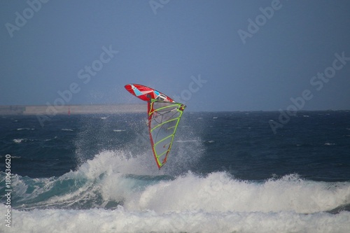 Windsurfer  upside down in the air