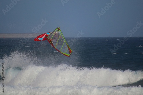 Windsurfer jumping a back loop