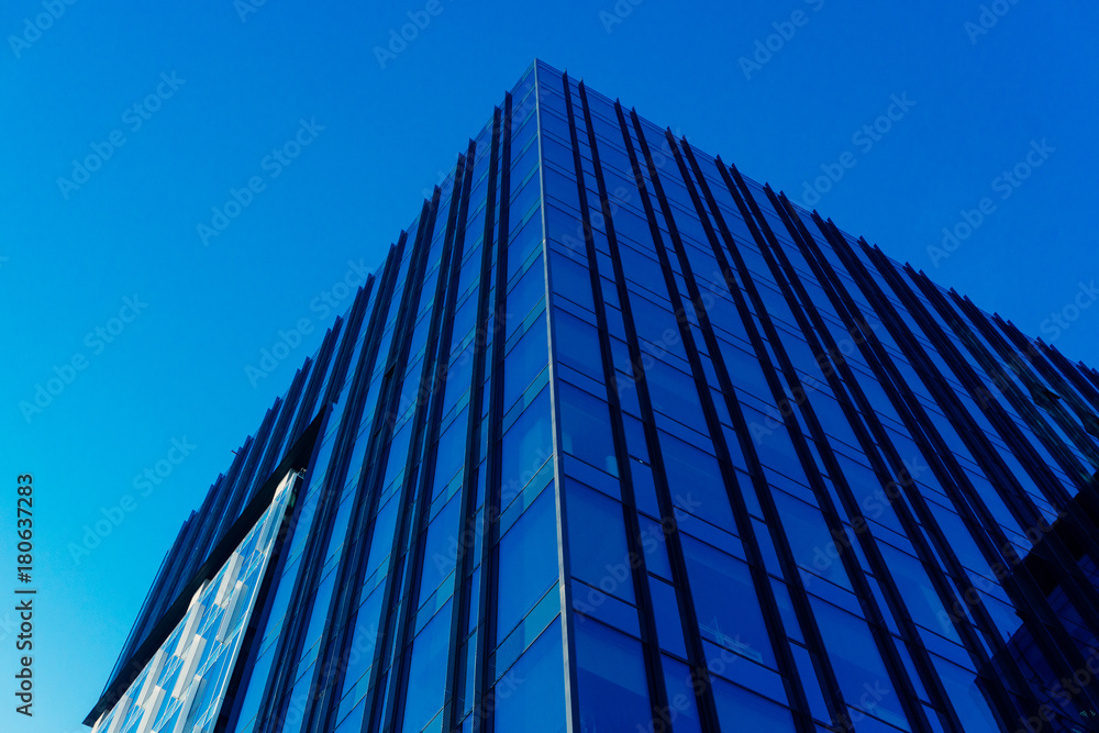 Modern glass skycrapers background with sky and clouds reflection of city Modern glass skycrapers background with sky and clouds reflection of city