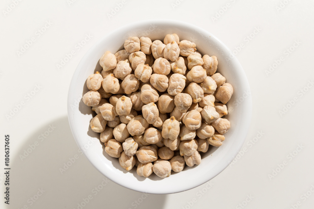 Chickpeas legume. Top view of grains in a bowl. White background Chickpeas legume. Top view of grains in a bowl. White background