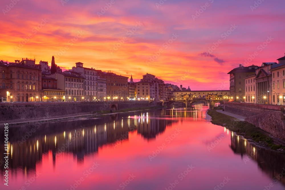 River Arno and famous bridge Ponte Vecchio at gorgeous sunrise in Florence, Tuscany, Italy