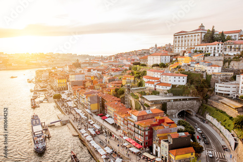 Top view on the Douro river with Ribeira promenade in the old town of Porto city during the sunset in Portugal