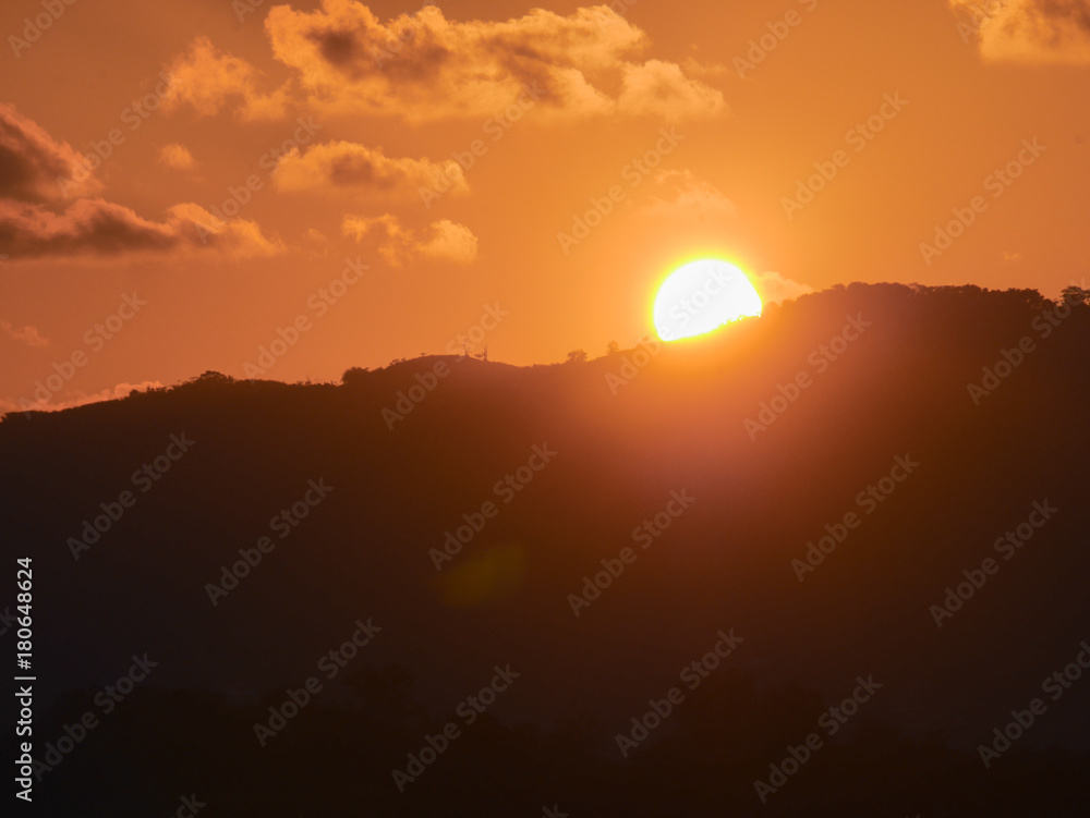 Sunset behind mountain And the evening sky