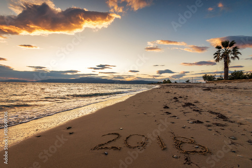 Fototapeta Naklejka Na Ścianę i Meble -  New year 2018 on the beach.