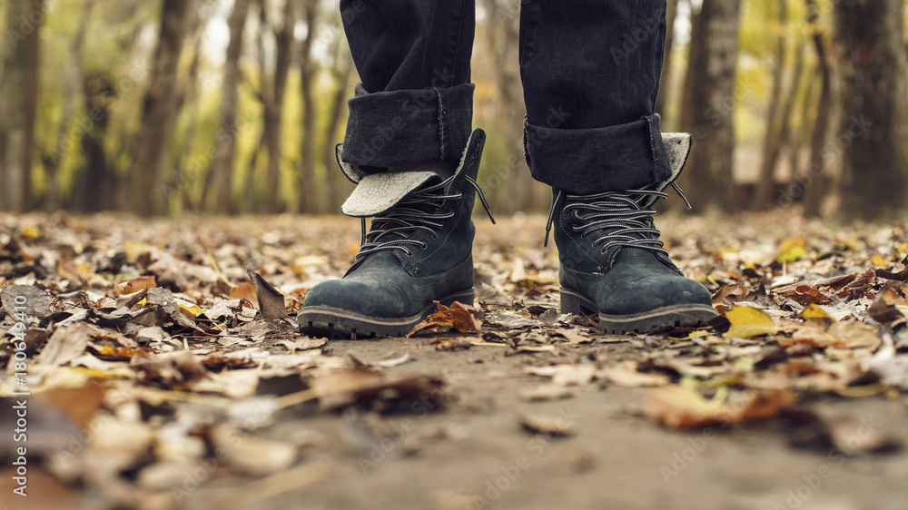feet boots autumn leaves