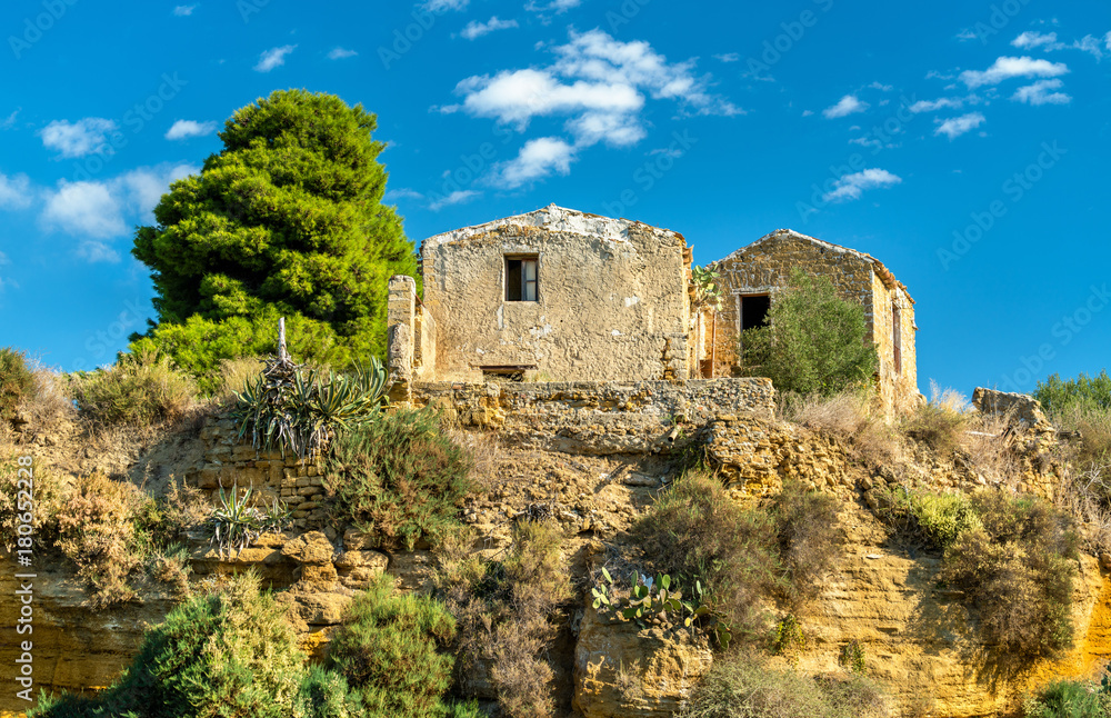 Ancient houses in the gardens of the Valley of the Temples - Agrigento, Sicily