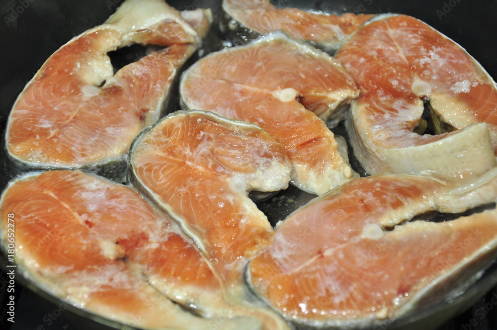 fresh fish, cut into steaks, pan-fried with butter and seasoned with spices fresh fish, cut into steaks, pan-fried with butter and seasoned with spices