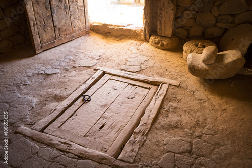 ancient wooden closed trapdoor in a rustic house photo