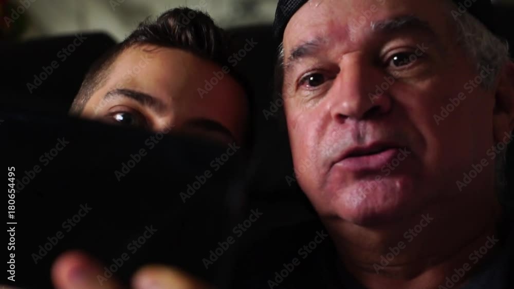 Father and Son with mobile phone on a Video Chat Father and Son with mobile phone on a Video Chat