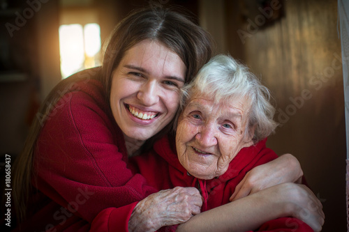 Portrait of Girl hugging her grandmother. photo