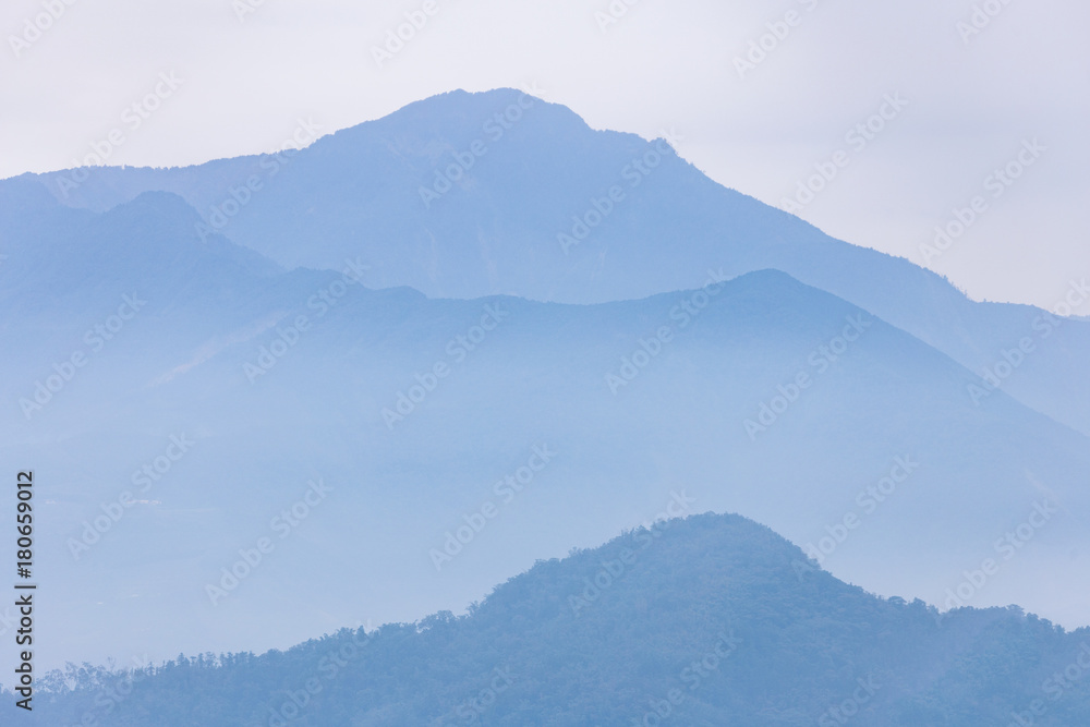 Hazy blue mountain of Sun Moon Lake in Taiwan during winter season.