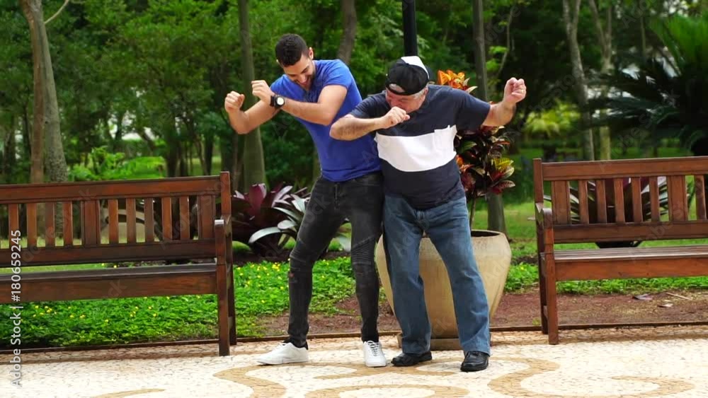 Father and Son Dancing and Having Fun