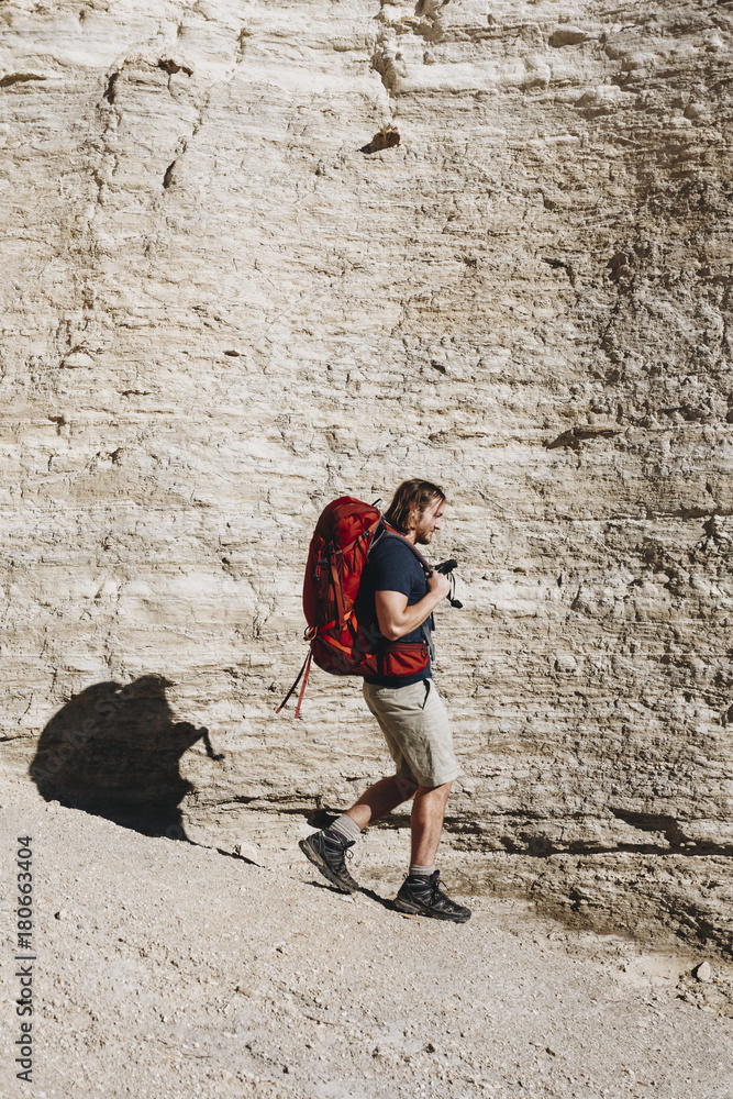 Hipster man traveling with backpack Hipster man traveling with backpack
