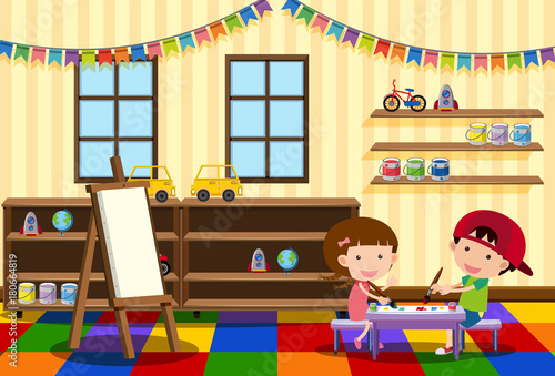 Two kids painting in the classroom