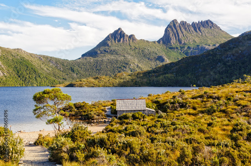 Historic Dove Lake boatshed beneath the towering spires of Cradle Mountain - Tasmania, Australia photo