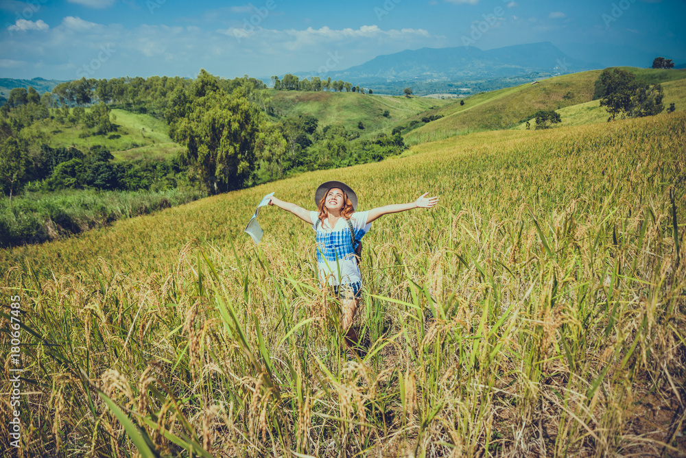 Asian women travel relax in the holiday. Expand survey map Mountain field. crop rices Ranch on hill. Thailand