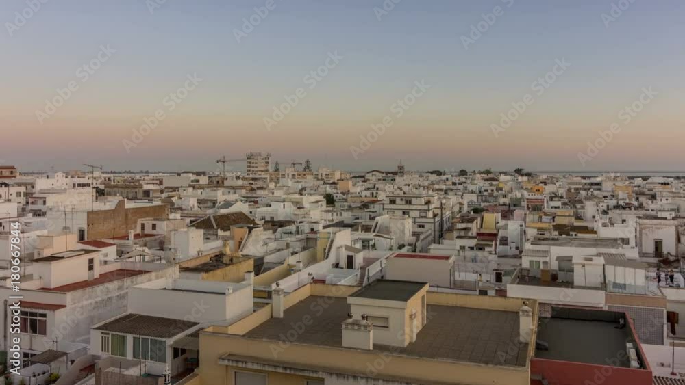 Day to Night pan timelapse cityscape of Olhao, fishing village, view of ancient neighbourhood and its traditional cubist architecture. Algarve, Portugal. Day to Night pan timelapse cityscape of Olhao, fishing village, view of ancient neighbourhood and its traditional cubist architecture. Algarve, Portugal.