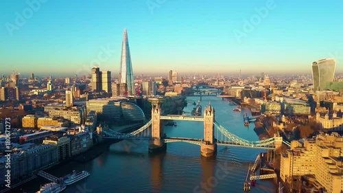 Aerial panning video of London and the River Thames with a view of the Shard and the London Tower Bridge