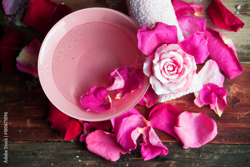 Perfume with rose leaves photo