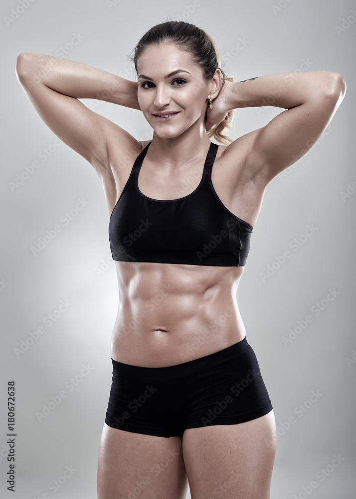 Fitness woman posing in gym outfit Fitness woman posing in gym outfit