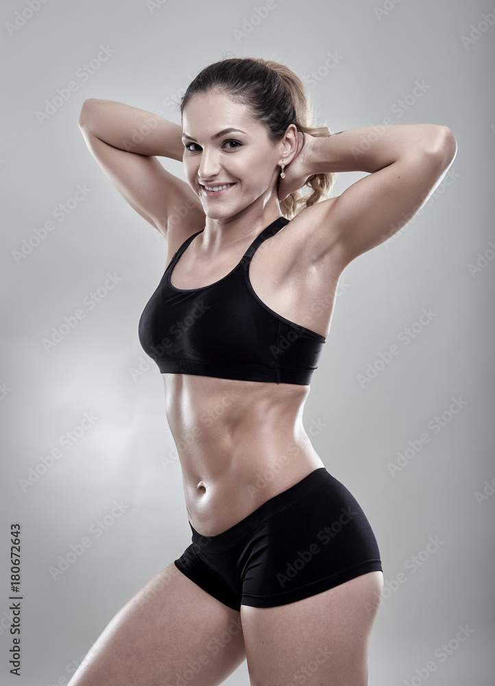 Fitness woman posing in gym outfit Fitness woman posing in gym outfit