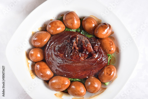 Canvas Print Braised pork trotters in brown sauce with eggs on the plate