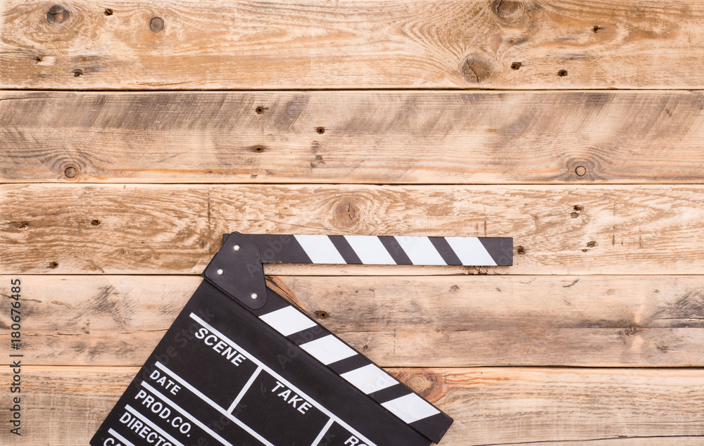 Obraz premium clapperboard on wood background