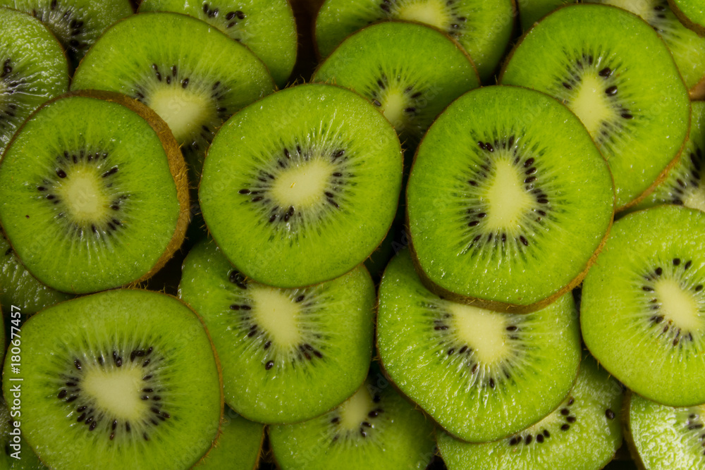 Fresh slices of kiwi fruit for background Fresh slices of kiwi fruit for background