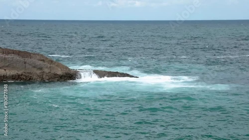 Sea waves beating against rocks