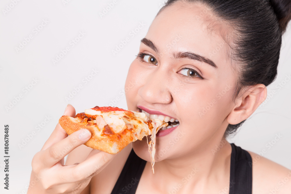 Happy girl eating tasty pizza. Isolated on a White Background. Happy girl eating tasty pizza. Isolated on a White Background.
