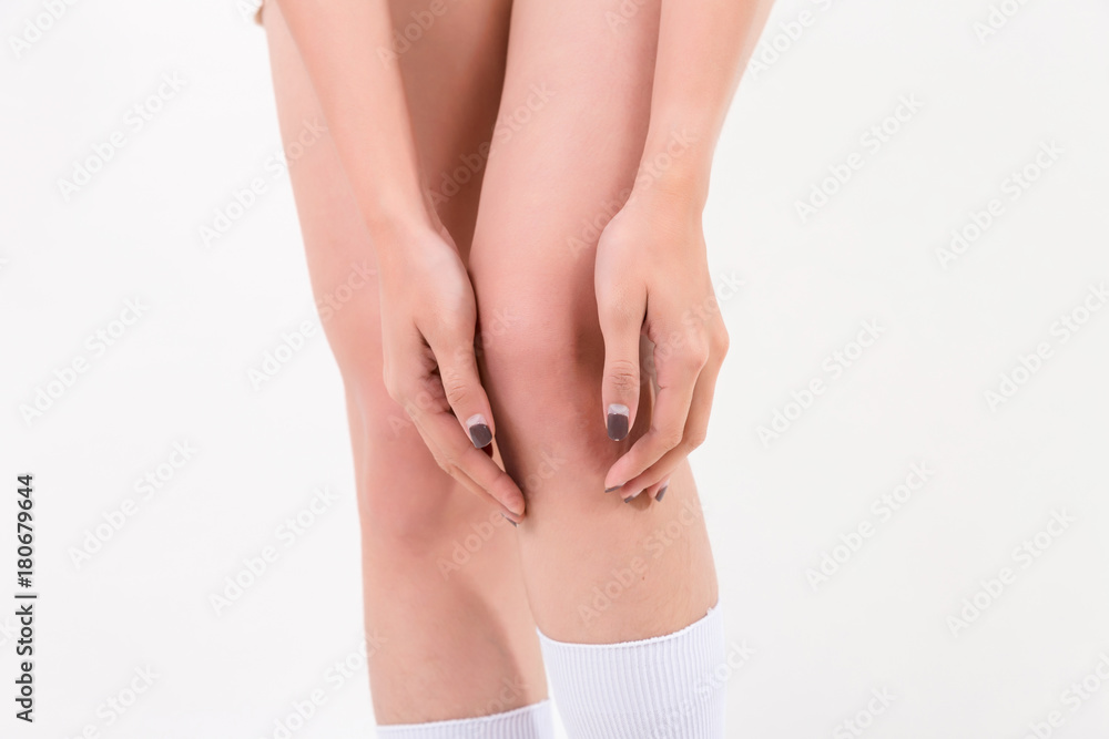 Woman with knee pain. Isolated on white background. Studio lighting. Concept for healthy and medical Woman with knee pain. Isolated on white background. Studio lighting. Concept for healthy and medical
