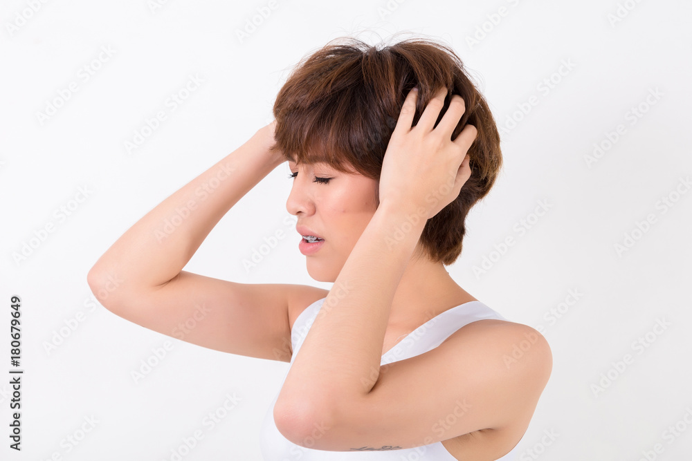 Health and pain. Stressed exhausted young woman having strong tension headache. Isolated on white background. Studio lighting. Concept for healthy and medical Health and pain. Stressed exhausted young woman having strong tension headache. Isolated on white background. Studio lighting. Concept for healthy and medical