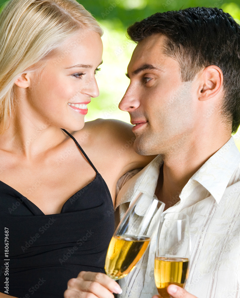 Young happy couple with champagne, outdoor Young happy couple with champagne, outdoor