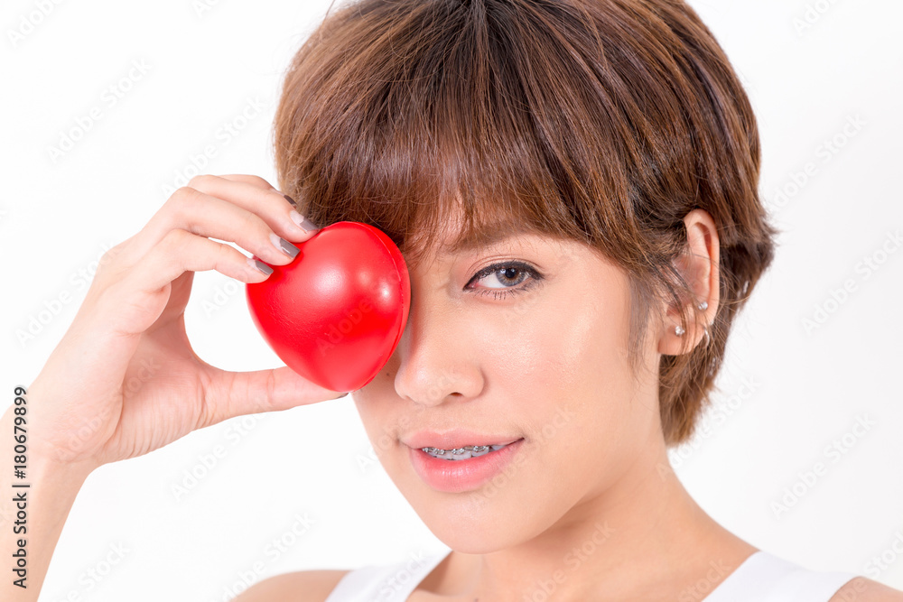 Beautiful young asia woman with red heart. Isolated on white background. Studio lighting. Concept for healthy. Beautiful young asia woman with red heart. Isolated on white background. Studio lighting. Concept for healthy.