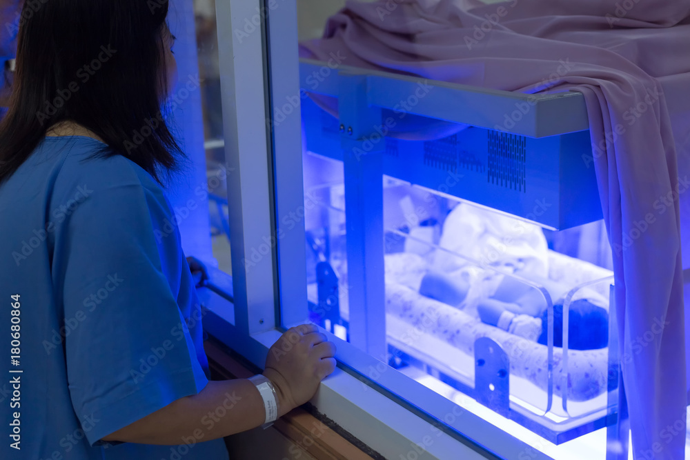 Mother watching at the Newborn baby with hyperbilirubinemia / Neonatal