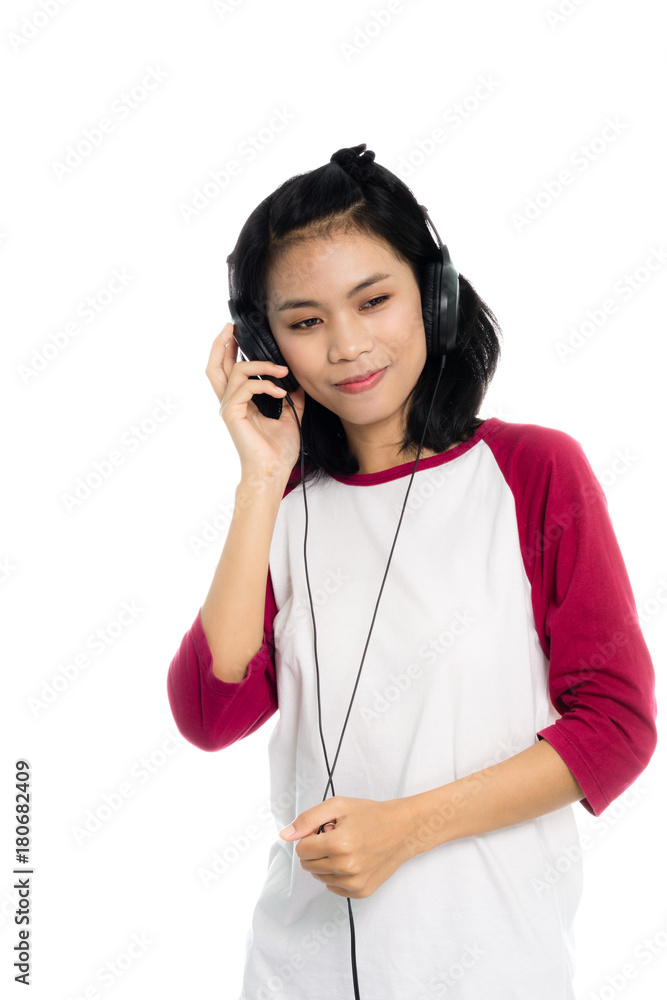 Portrait of a woman smiling with earbuds / headphone for listening to music or talking on smart phone. Isolated on white background