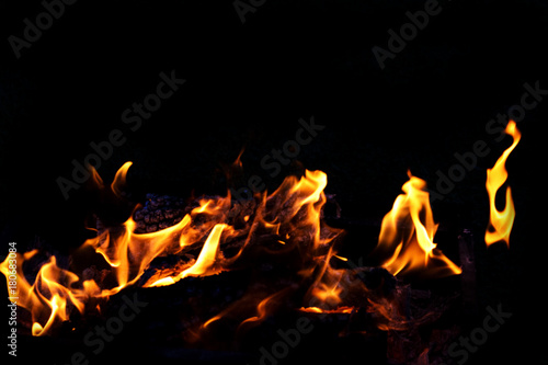 Fire flames on dark background © olyjo