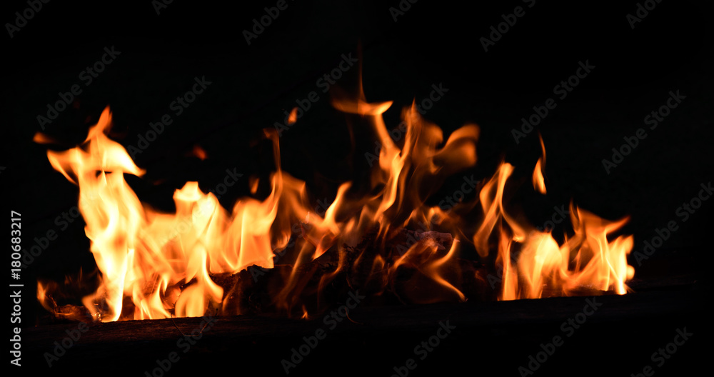 Fire flames on dark background Fire flames on dark background