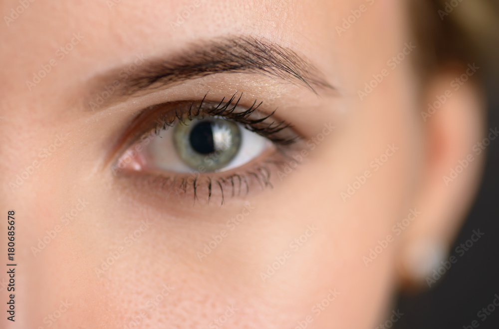 Fototapeta premium Human green eye with reflection. Macro shot.