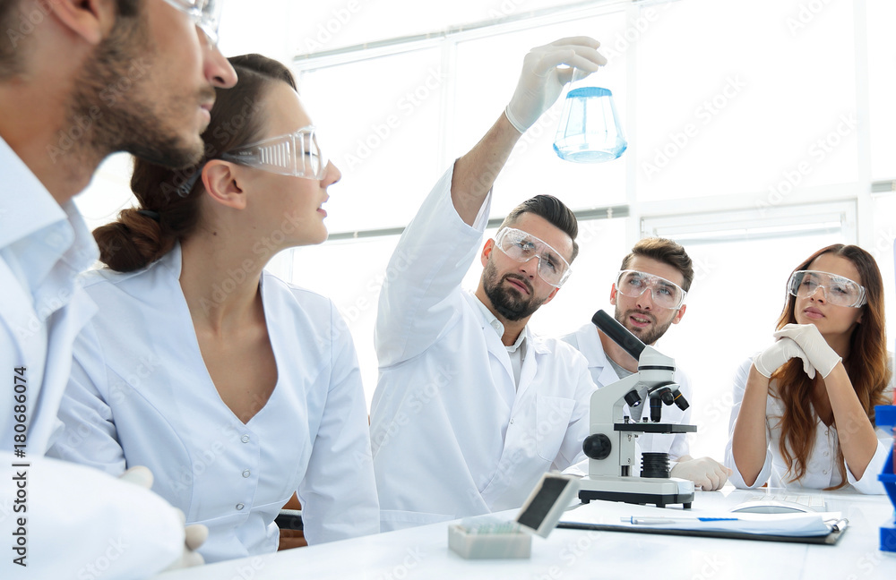 group of young workers are working in biochemistry lab, group of young workers are working in biochemistry lab,