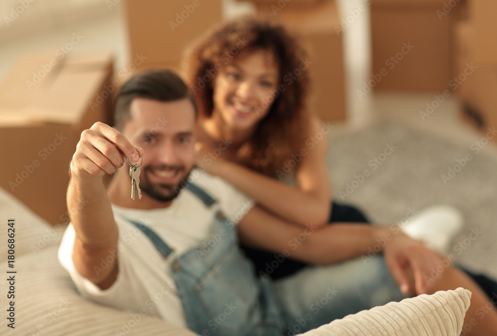 Young couple with a key to a new apartment. Young couple with a key to a new apartment.