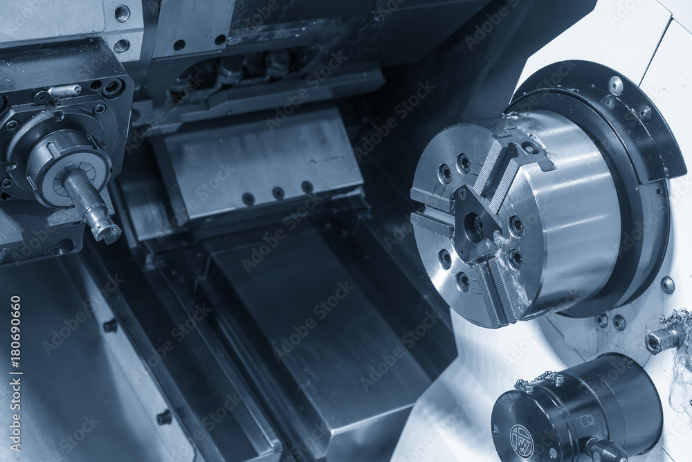 The CNC lathe or turning machine with the milling spindle . The turn-mill machine Hi-precision CNC machining concept. The CNC lathe or turning machine with the milling spindle . The turn-mill machine Hi-precision CNC machining concept.