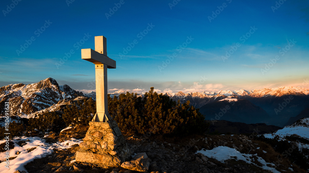 Mountain panorama from the summit where a cross is placed