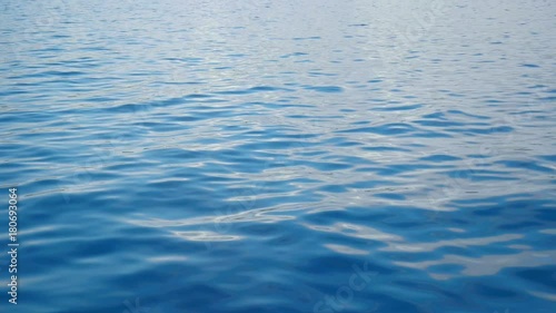 Beautiful blue calm Adriatic sea with small waves moving. Filmed in super slow motion hd.